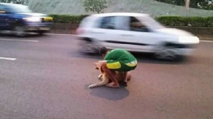 Illustration : Un jeune polynésien risque sa vie pour secourir un chien au milieu du trafic